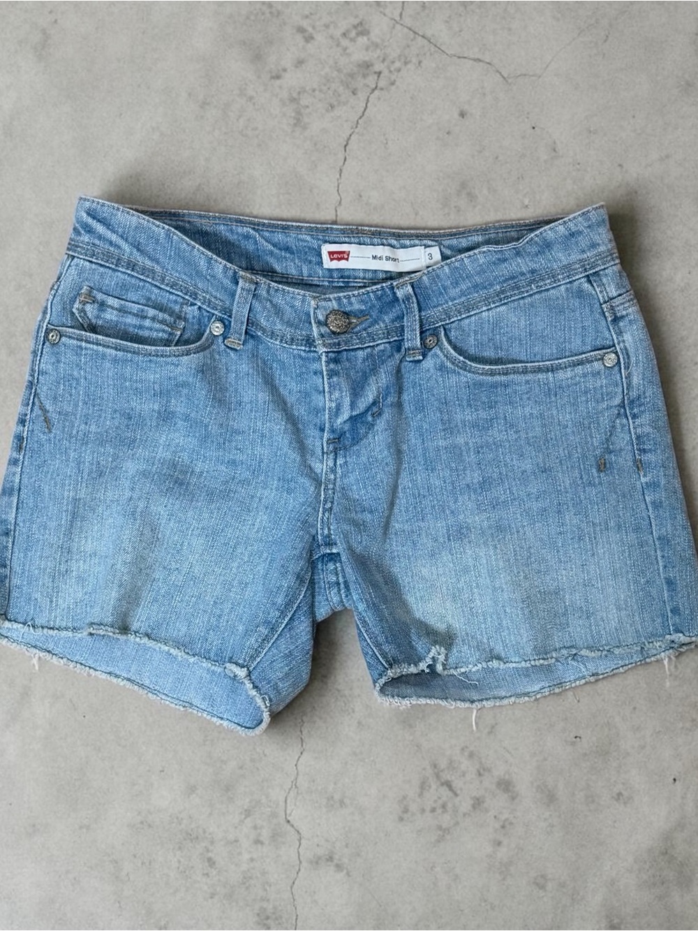 Levi’s Midi Short Raw Hem Low Rise Denim Light Blue